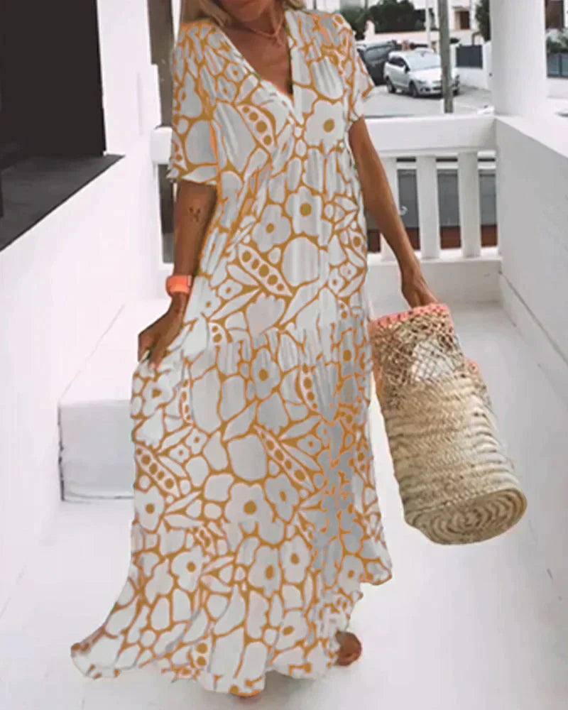 Christine™ | Vestido largo de verano con caída fluida y un estampado gráfico refinado