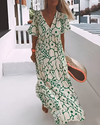 Christine™ | Vestido largo de verano con caída fluida y un estampado gráfico refinado