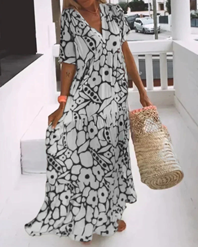 Christine™ | Vestido largo de verano con caída fluida y un estampado gráfico refinado